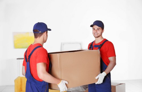 Removal van and moving crew serving homes in Wapping