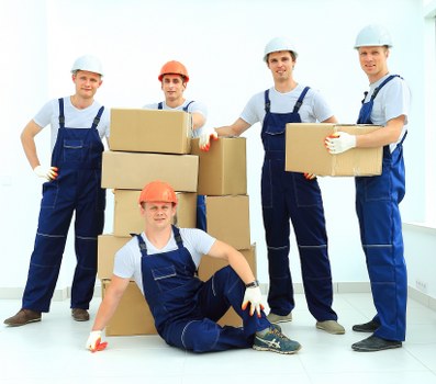 Local van moving boxes and household items near Wapping