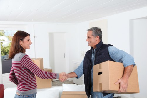 Moving team handling furniture near Wapping homes