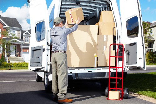 Local moving van helping with furniture transport in Wapping