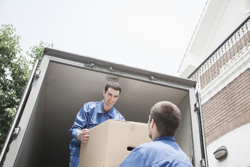 Professional movers loading items for a local Wapping relocation