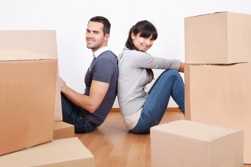Packed boxes and removal team preparing for a local East London move