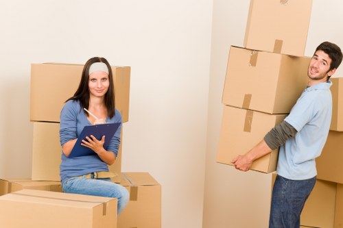 Local moving team handling boxes and furniture in Wapping