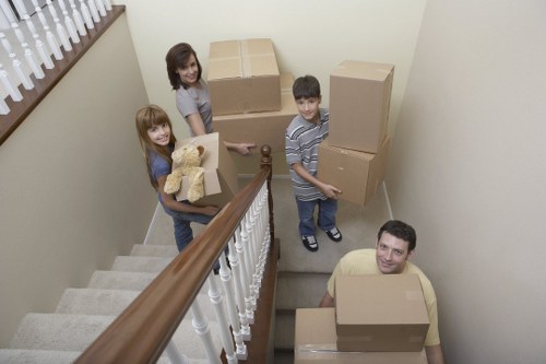 Moving boxes and household items ready for removal in Wapping